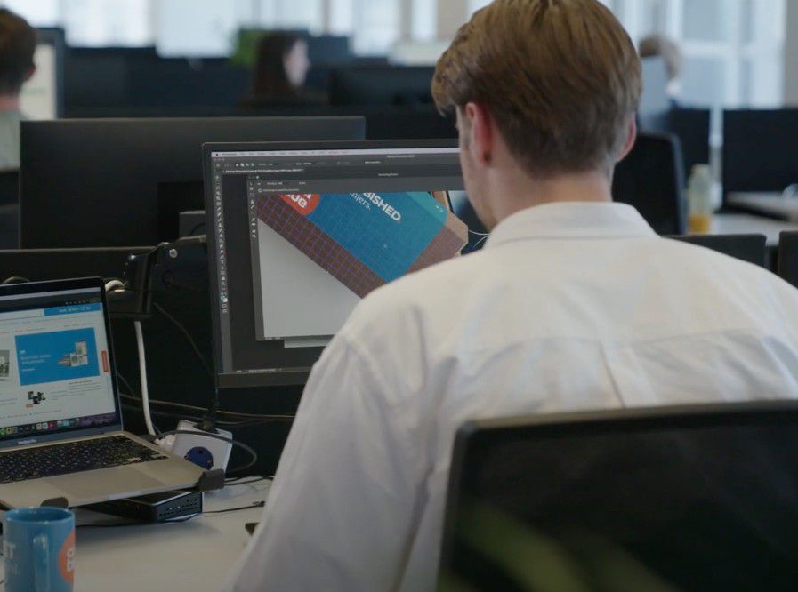 Olaf designing the refurbished iPhone box in Photoshop at the Coolblue creative agency