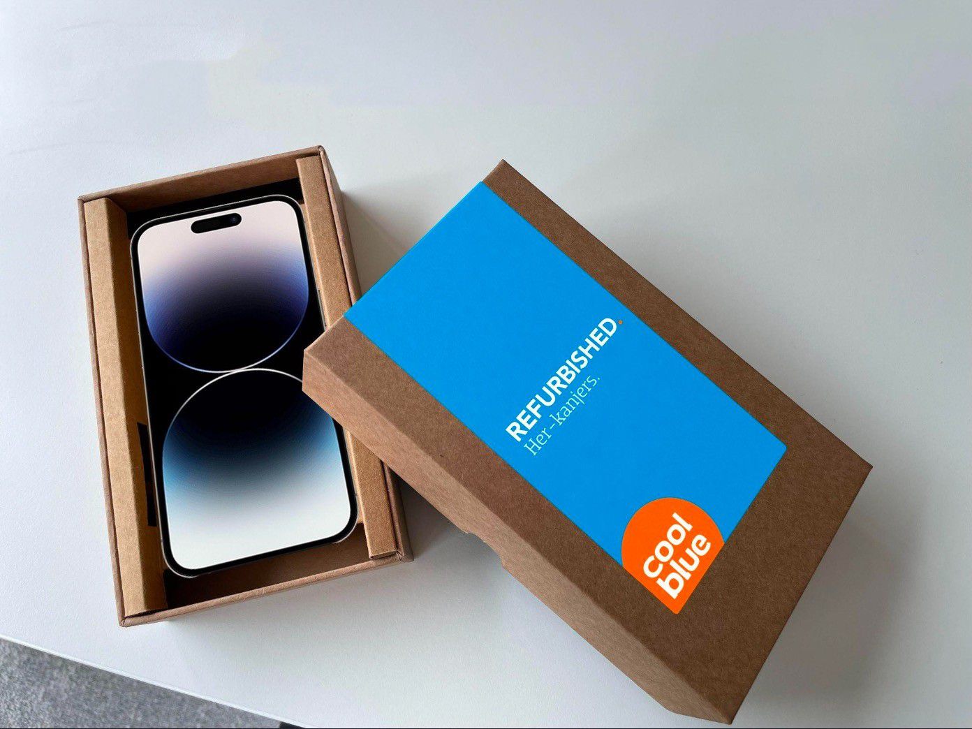 The final design on the sample box, open with an iPhone inside